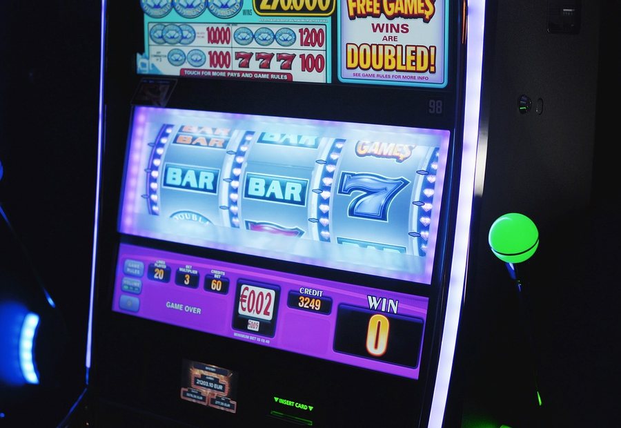 Slot machines lit in a gaming room