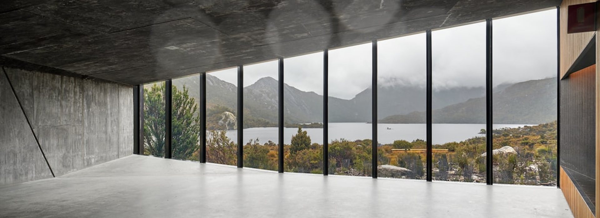 Hotel room with a full-width window onto the lake