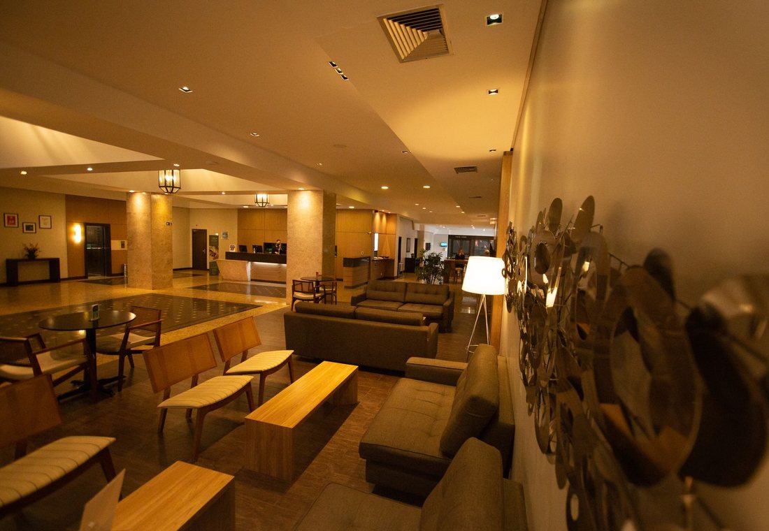 Hotel lobby lounge with armchairs and daylight